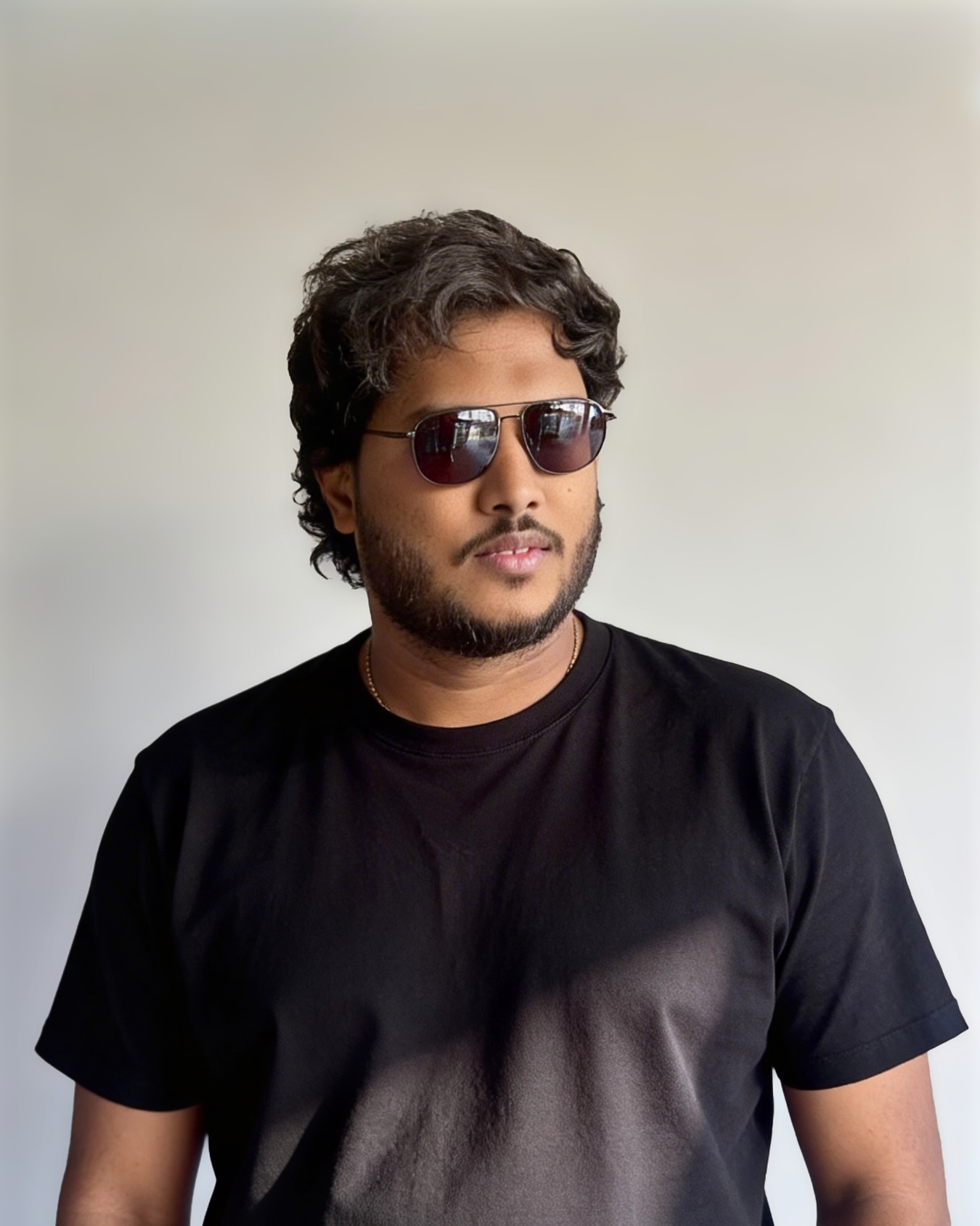 Arun Samanta in sunglasses and a black t-shirt
