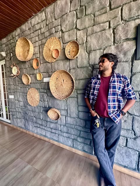 Arun Samanta leaning against a stone wall